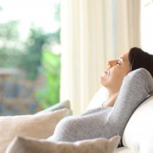 a woman smiling comfortably after resting well