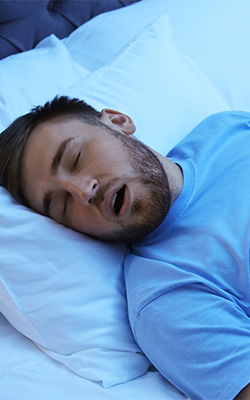 man sleeping with mouth open