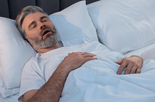 a man sleeping with his mouth open